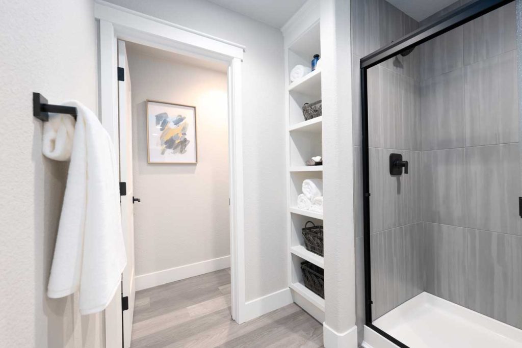 Second Bathroom with step-in shower and tile of Parkside Villas Townhomes Model Home